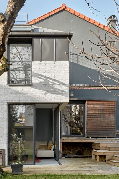 ThermoSystem 68 Fenêtres, SlimPatio 68 Coulissants et ThermoRoof 200 Vérandas - Extension à Malakoff : confort et lumière situé à Malakoff, France