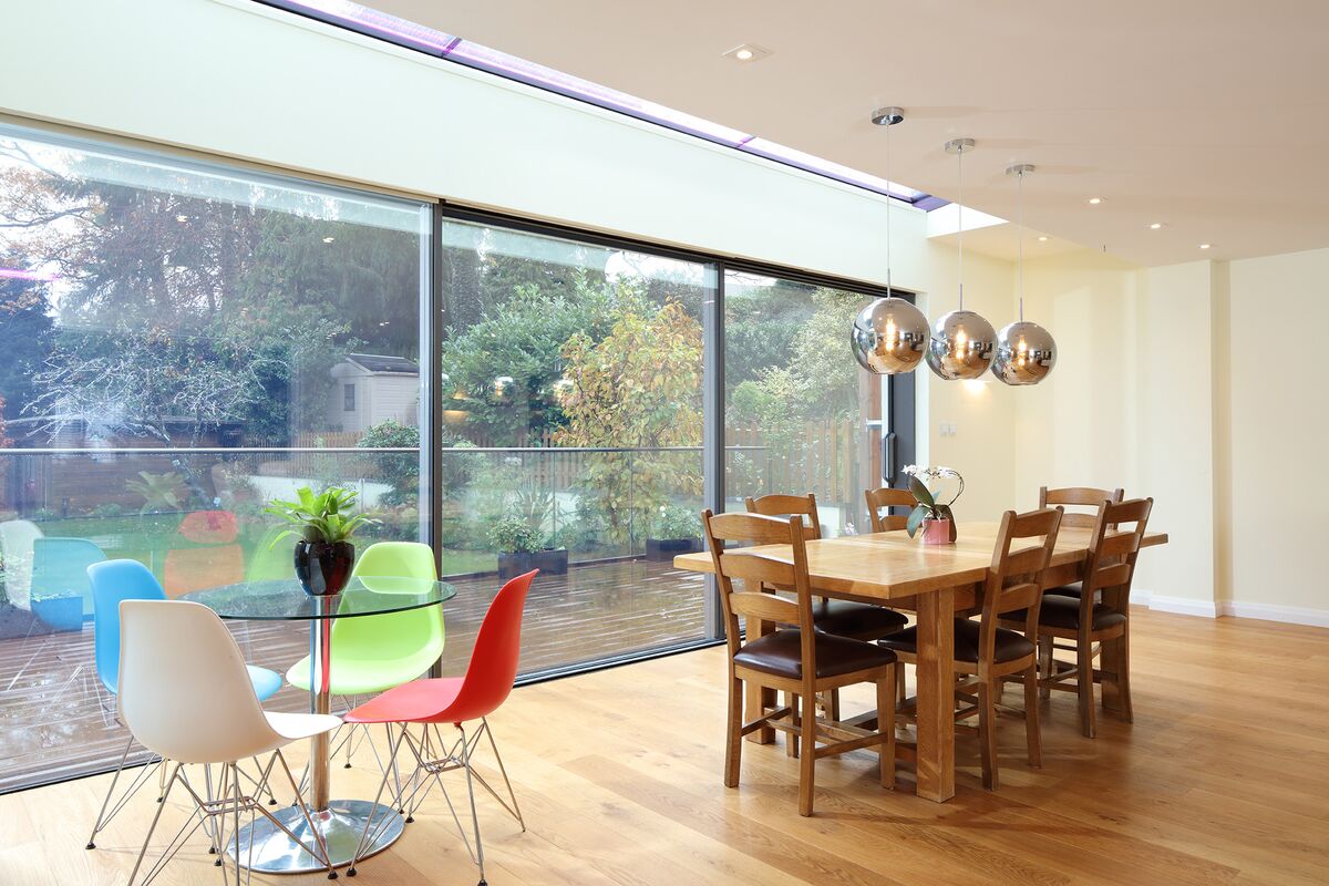 A kitchen with large sliding doors