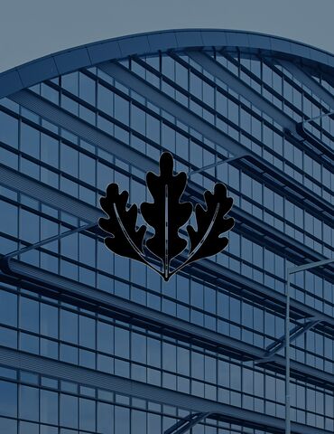 LEED logo in front of modern office building.